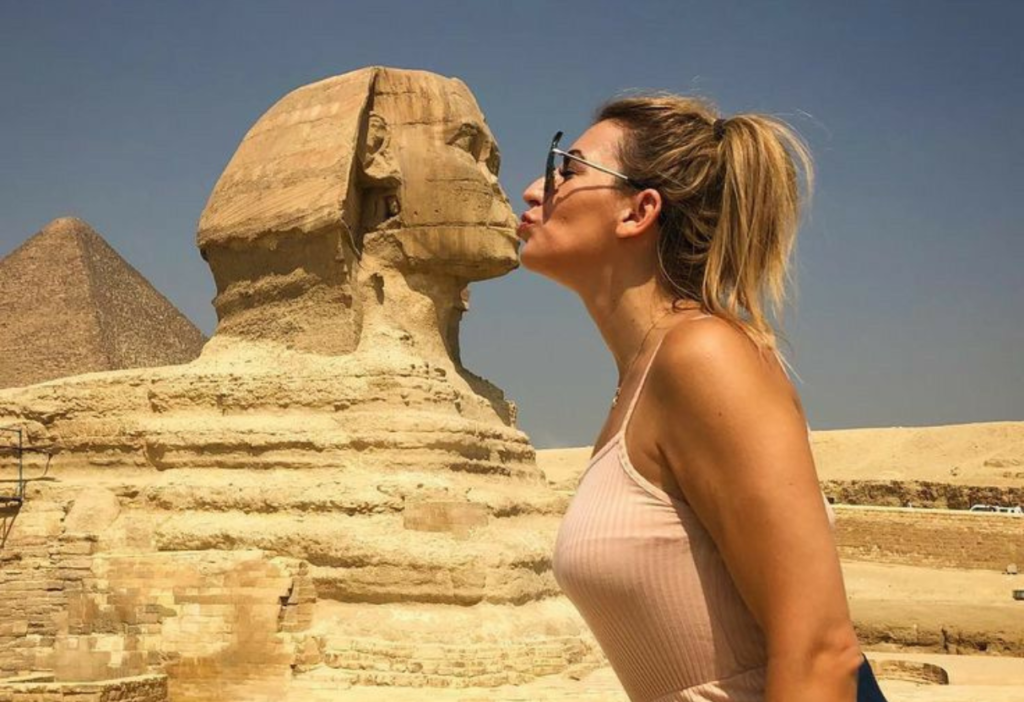 the-beautiful-girl-kissing-sphinx-statue-in-egypt-travel